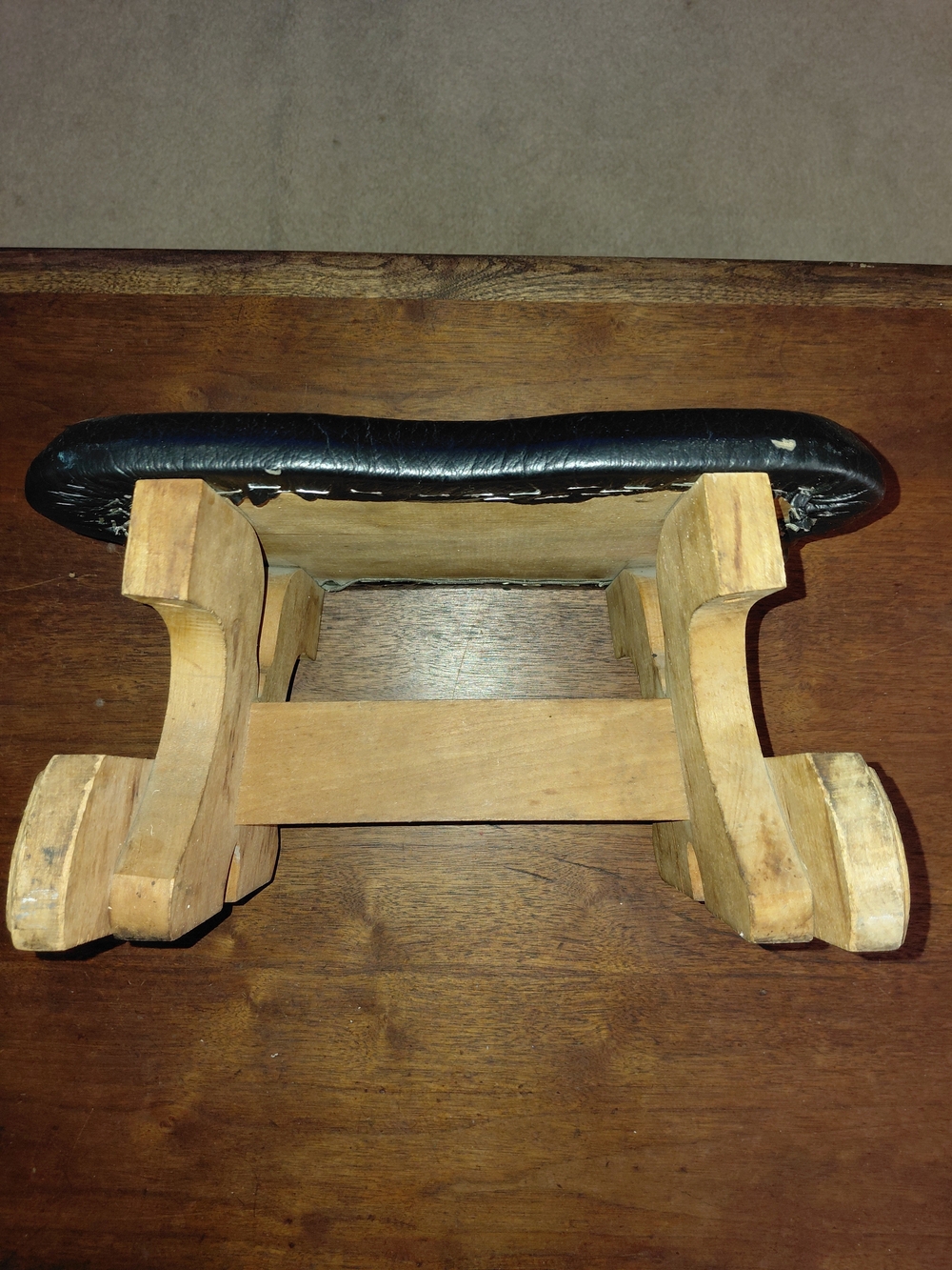Vintage Black Cushioned Footstool with Natural Wood